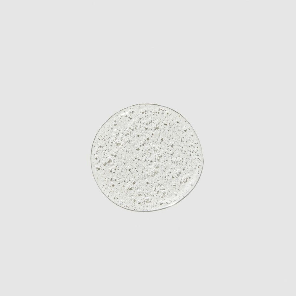 Paul Mitchell Super Strong Shampoo texture closeup shows creamy, conditioning-rich consistency
