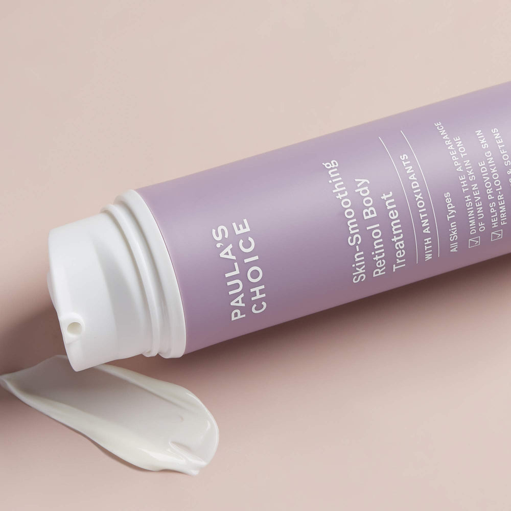 Hands applying Paula's Choice Retinol Lotion on arm for smoother texture