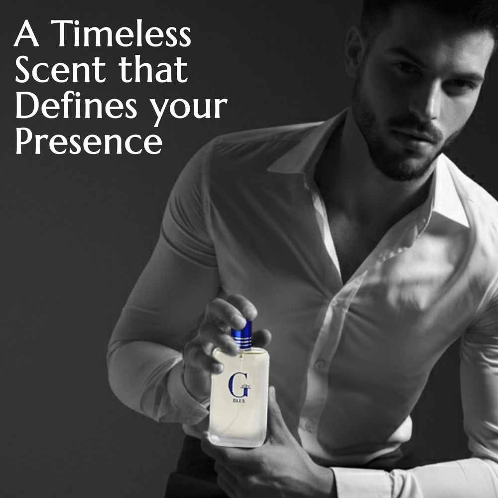 PB ParfumsBelcam G Eau Blue bottle with light mist on skin outdoors.