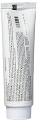 Tube and packaging displayed for travel-friendly routine.