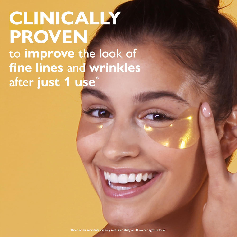 Peter Thomas Roth 24K Gold eye patches being applied under the eyes.