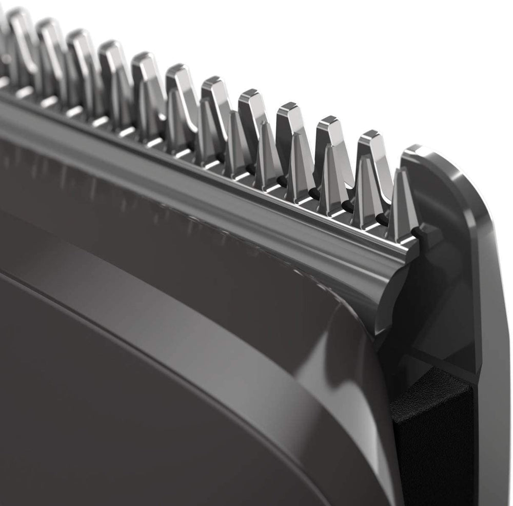 Philips Multi Groomer 8000 Series ergonomic metal frame and grip in hand.