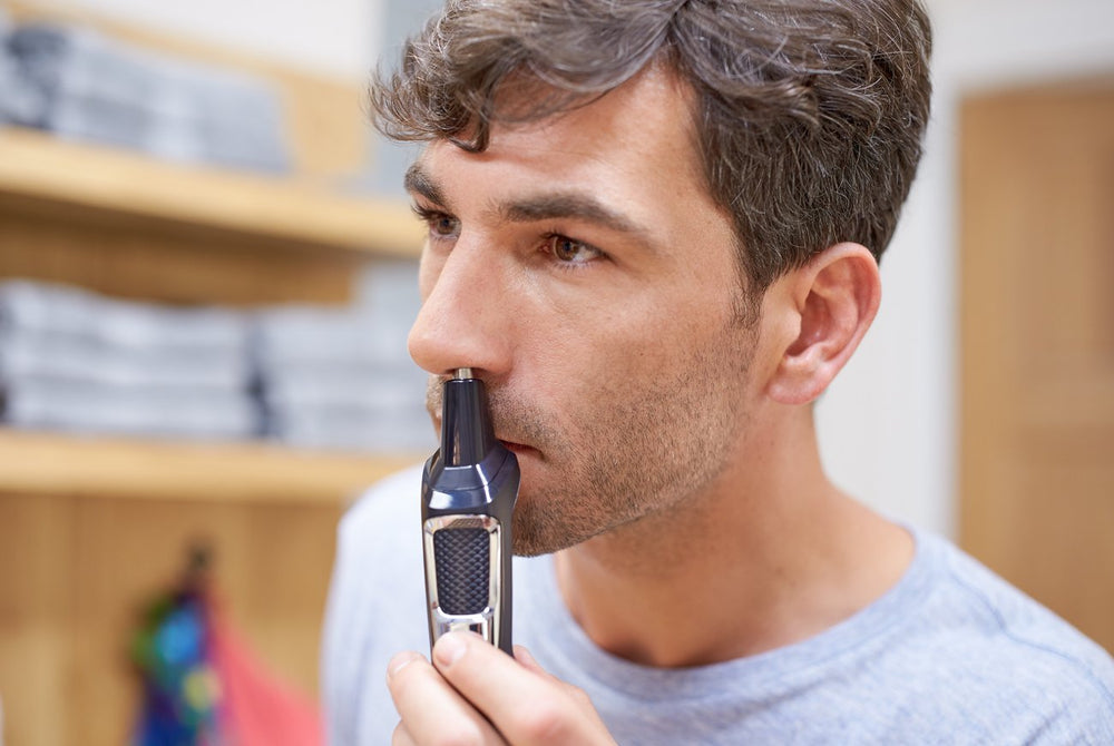 Philips Norelco Multigroom 3000 beard and hair guards included.