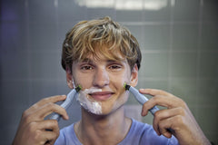 Philips OneBlade First Shave in-shower use demonstrates convenient cleanup after shaving.