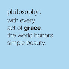 Philosophy Pure Grace bottle on surface suggests everyday elegance.