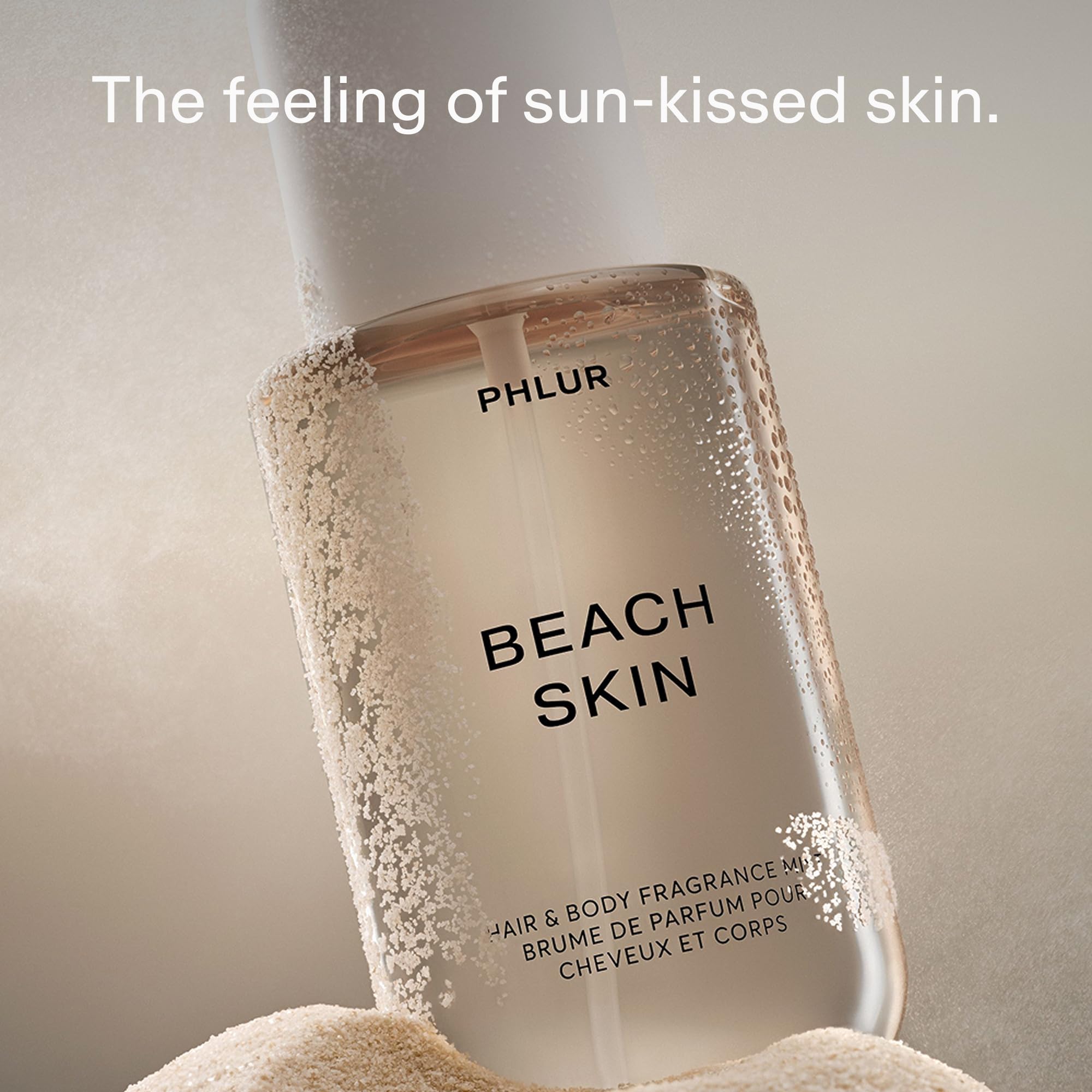PHLUR Beach Skin Mist being applied to hair for subtle fragrance