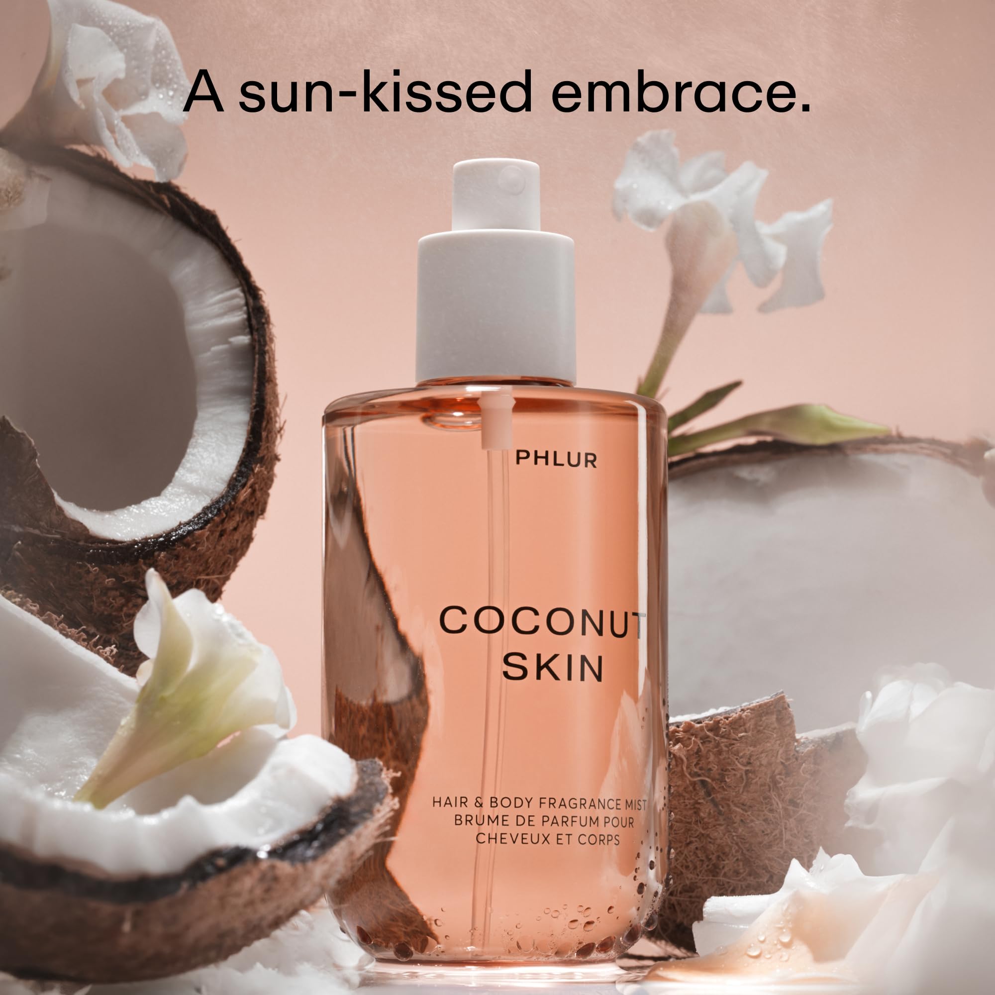 PHLUR Coconut Skin Body Mist spray on skin for a light scent.