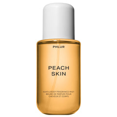 PHLUR Peach Skin Body Mist bottle with peach bellini notes for daily freshness.