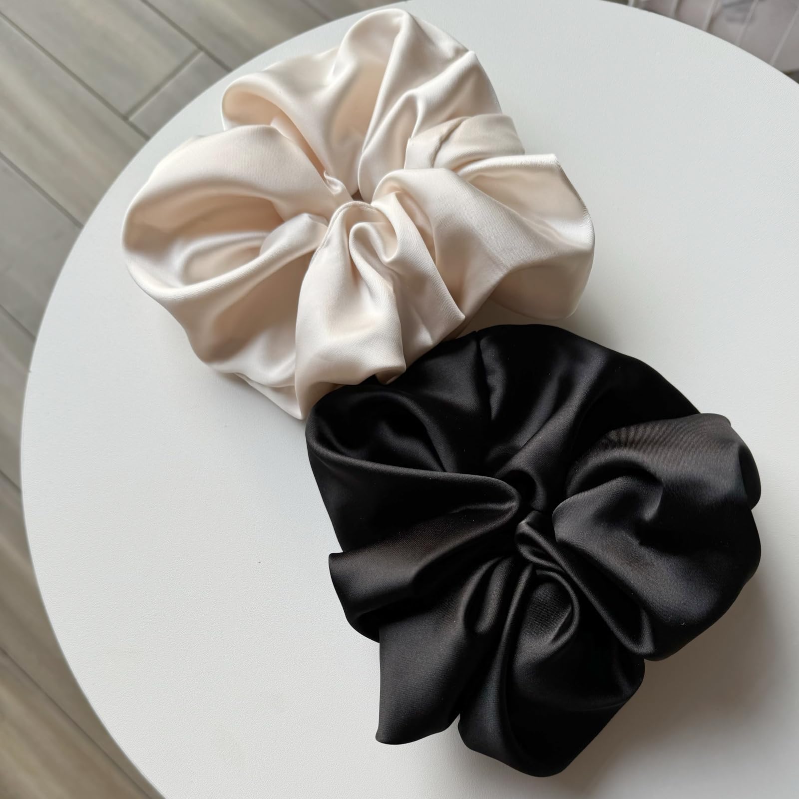 PIDOUDOU satin scrunchie used to create a neat bun with comfort