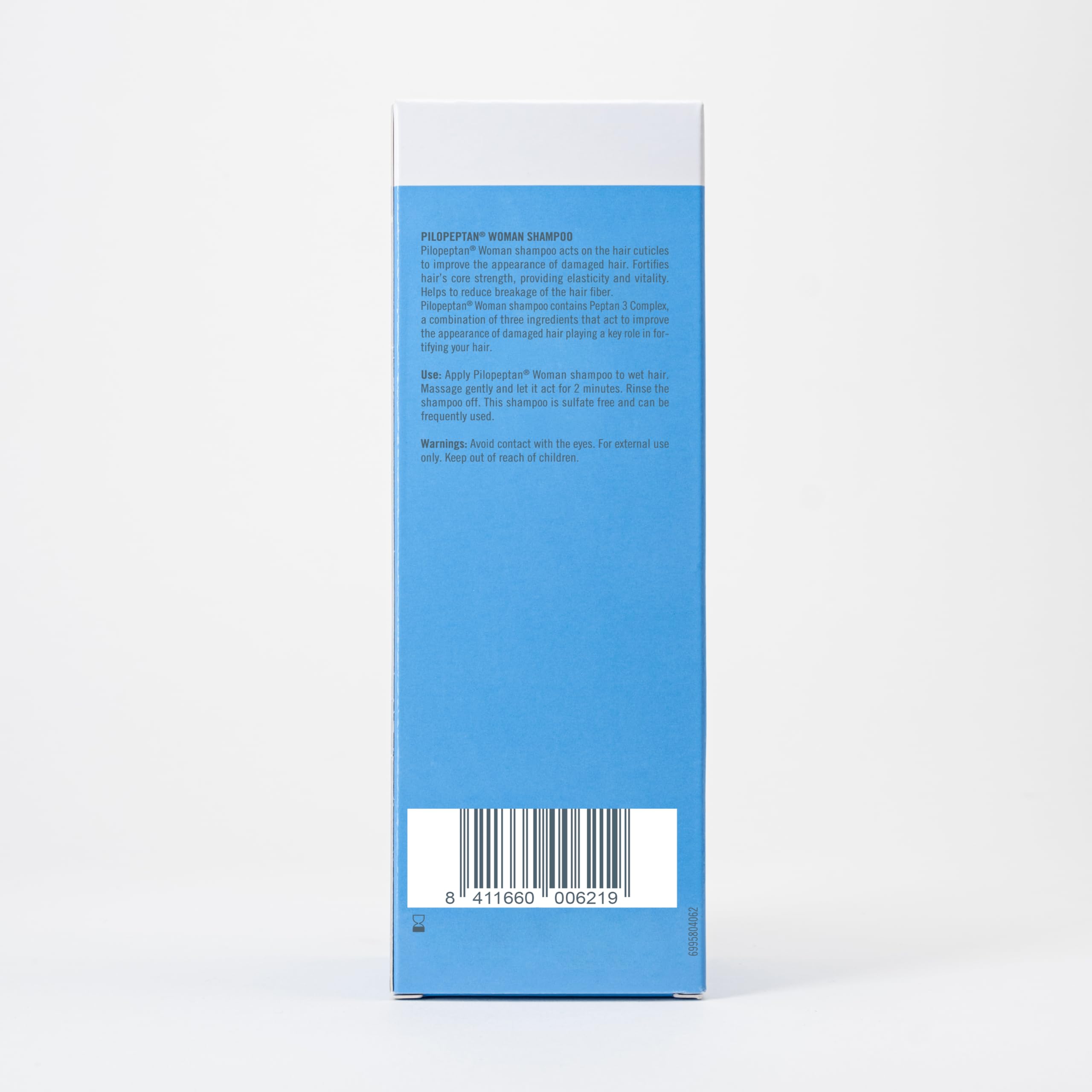 Bottle label emphasizes volumizing formula of Pilopeptan Woman Shampoo