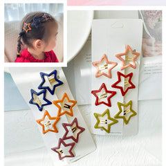 Clip metálico Pinksee estrella en colores brillantes para looks diarios.