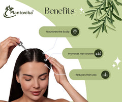 Plantovika rosemary oil on hair strands to help reduce breakage and add natural shine.