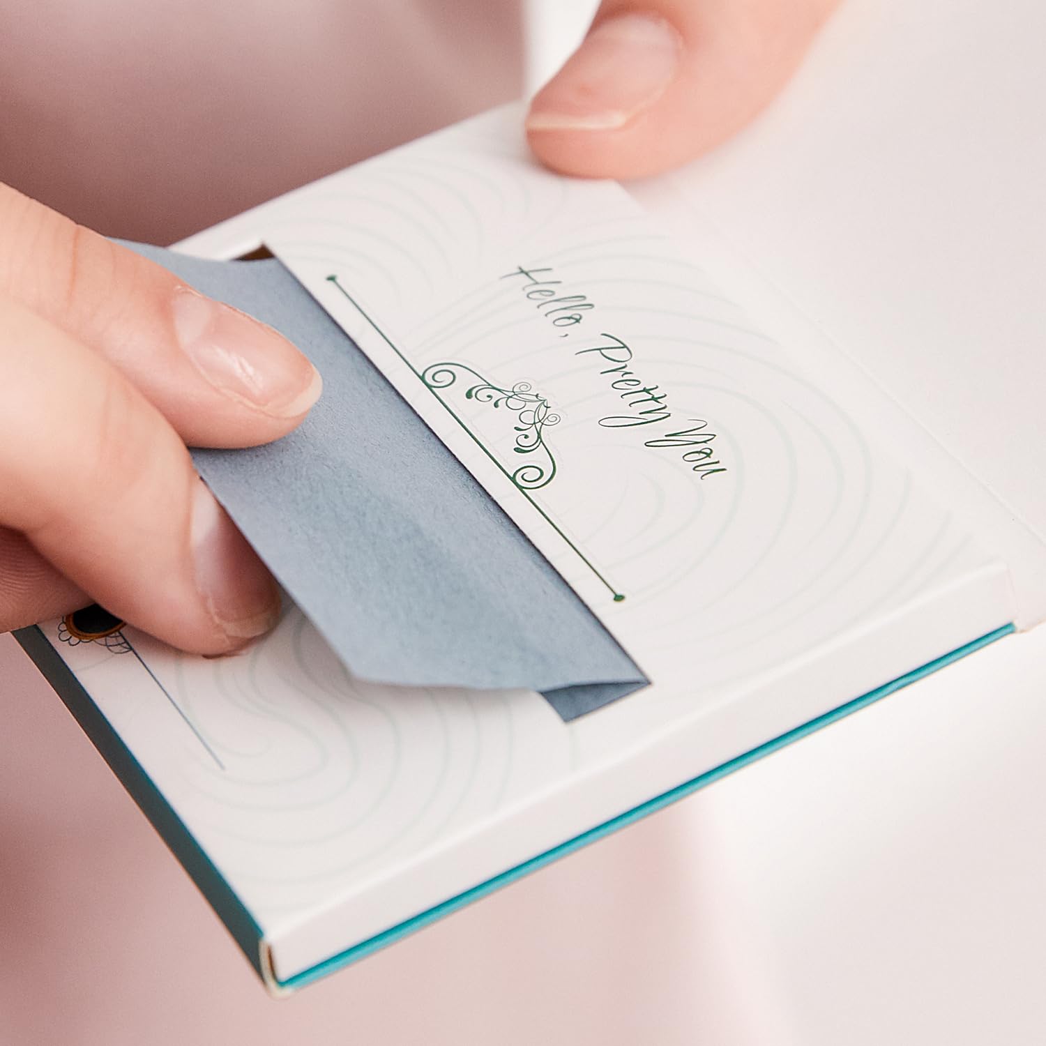 PleasingCare blotting sheets shown in dispenser packaging for waste-free use