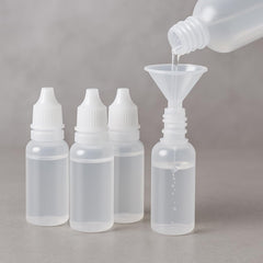 Pretwad 5-piece bottle set with funnel for easy refills.