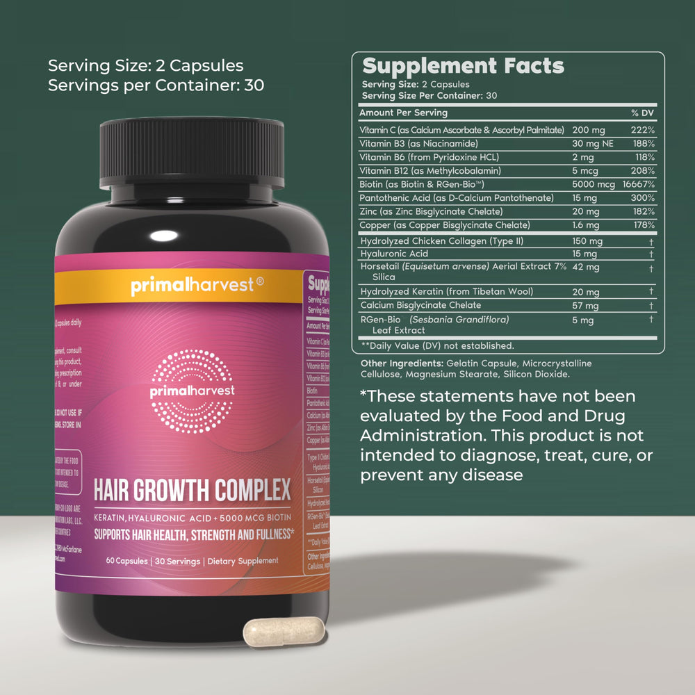 Close-up of Primal Harvest hair growth vitamins pills, small and easy to take.