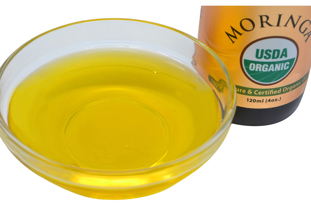 Prime Natural Moringa Oil on a spoon suggests food use with mild flavor