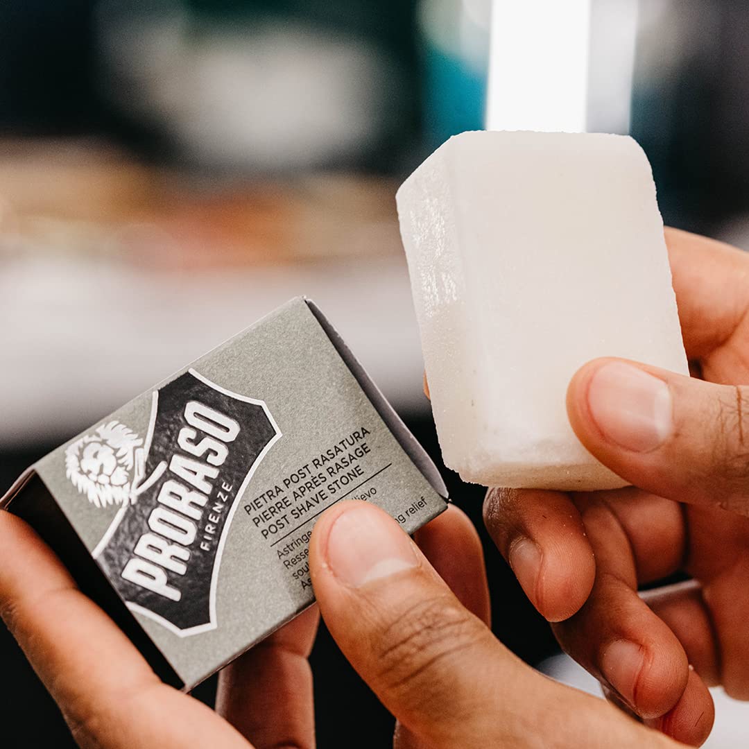 Proraso alum block being applied to shaved skin for calm, reduced irritation.