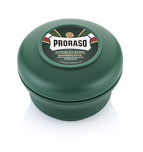 Proraso shaving brush lathering over the soap to build rich foam.