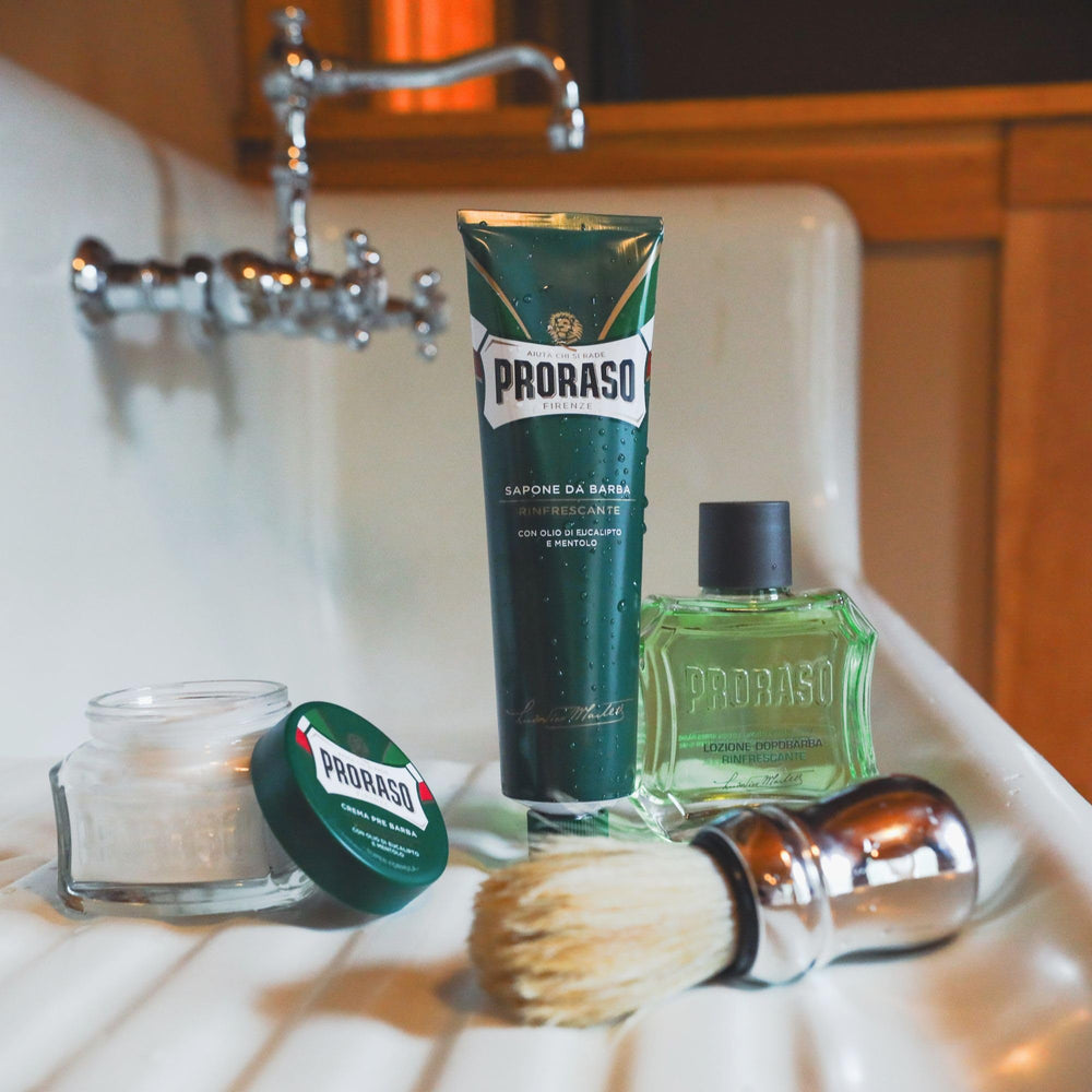 Proraso Shaving Cream thick lather forming on a brush with water for protection.