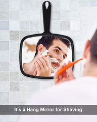 PROTECLE two-way mirror can hang or be handheld for versatile grooming