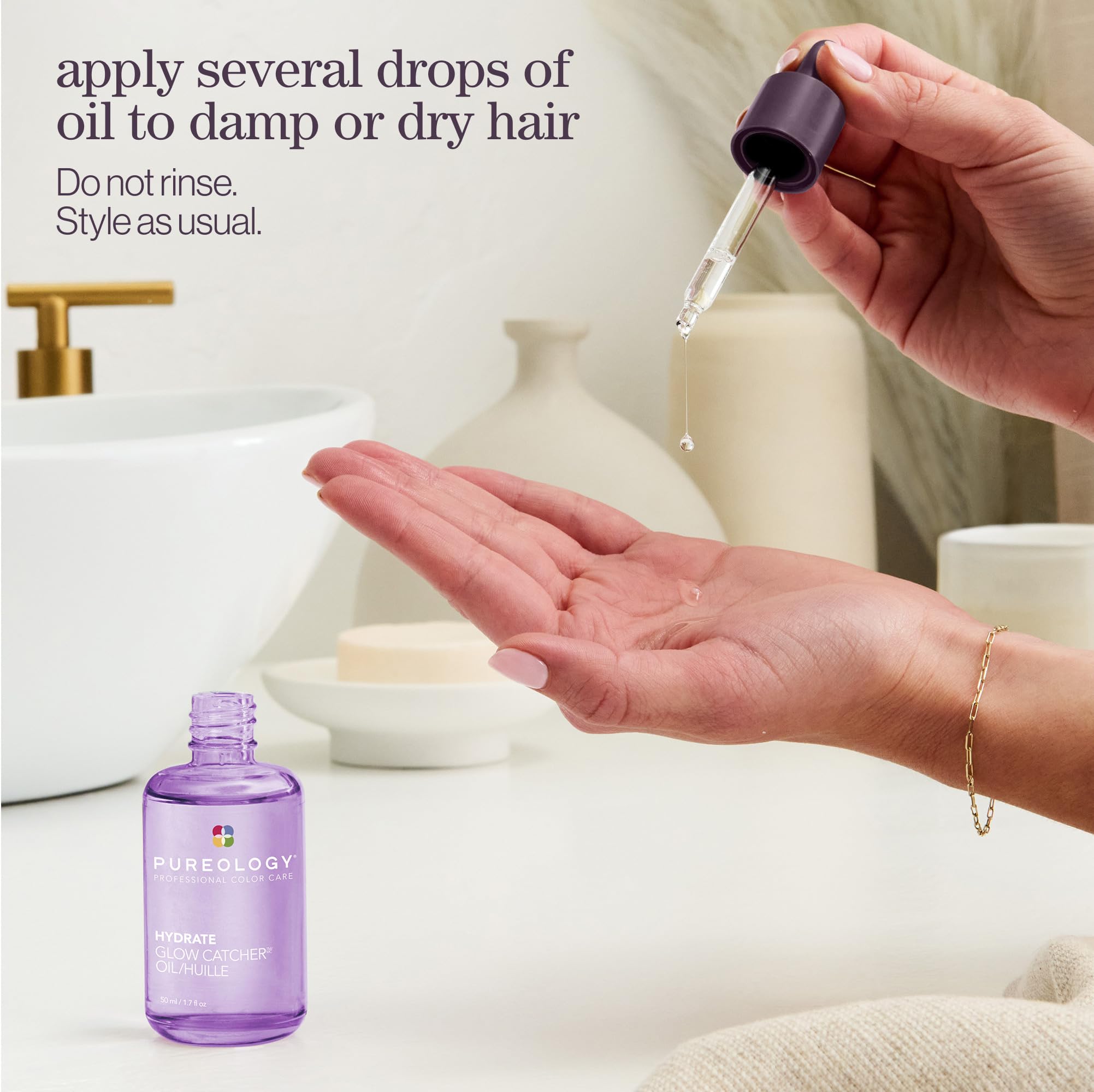 Pureology Hydrate Glow Catcher Oil texture shown on hand for light feel.