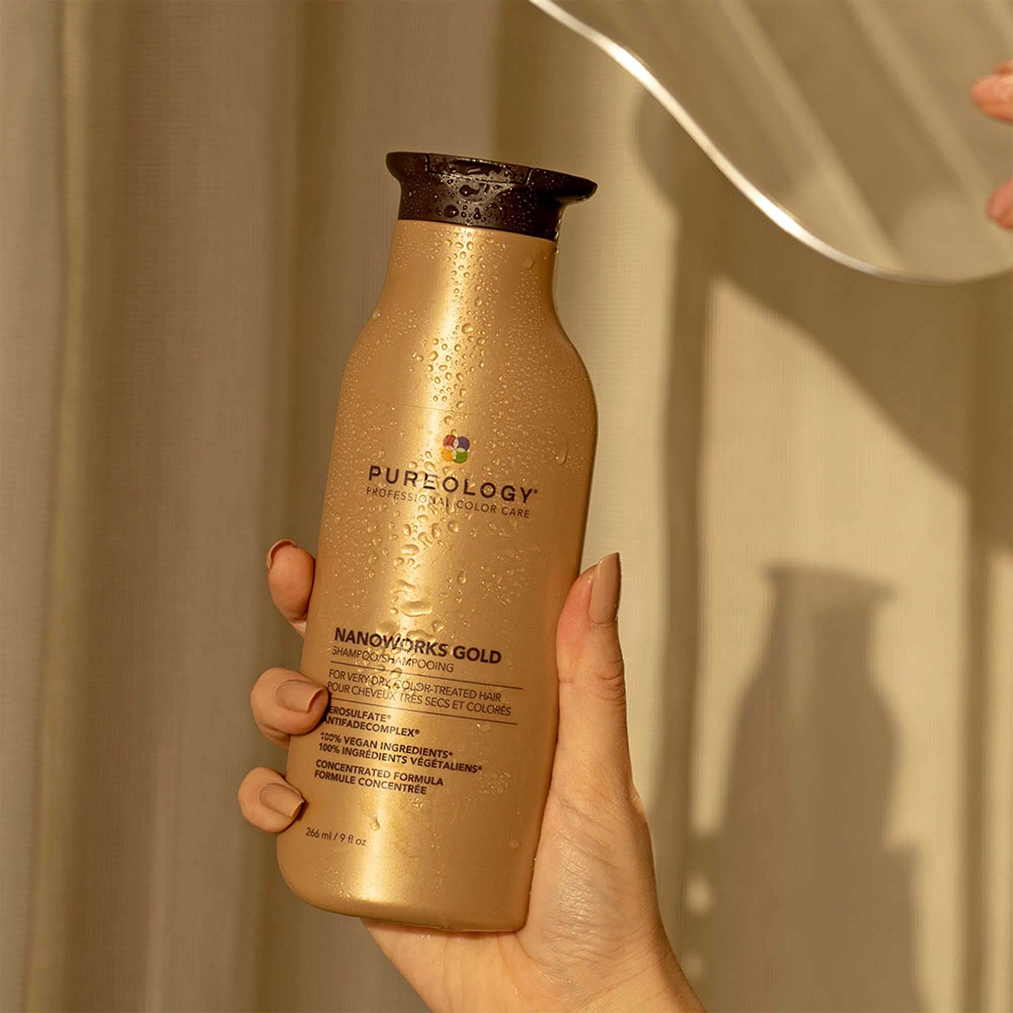 Pureology Nanoworks Gold color-protection graphic highlights fading defense for color-treated hair.
