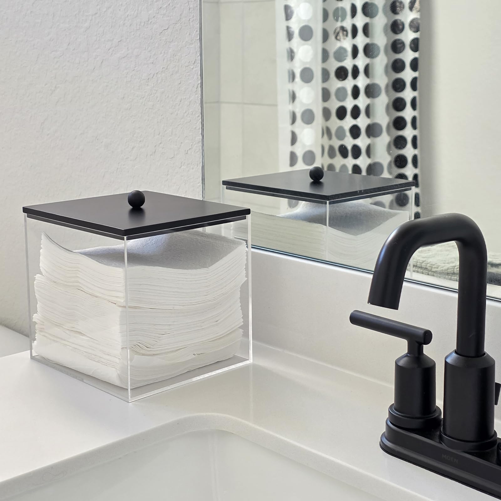 Puricon clear acrylic bin for facial towels with black lid enhances countertop organization.