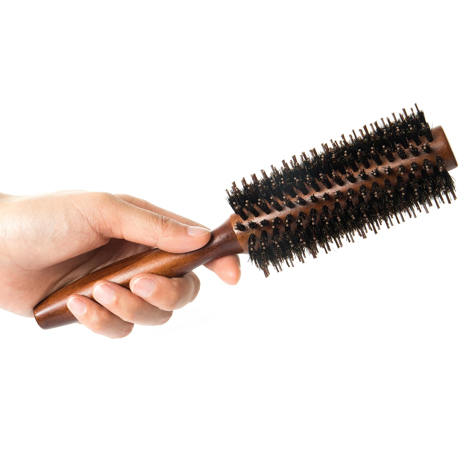 Puto close-up of boar bristles distributing natural oils for shine