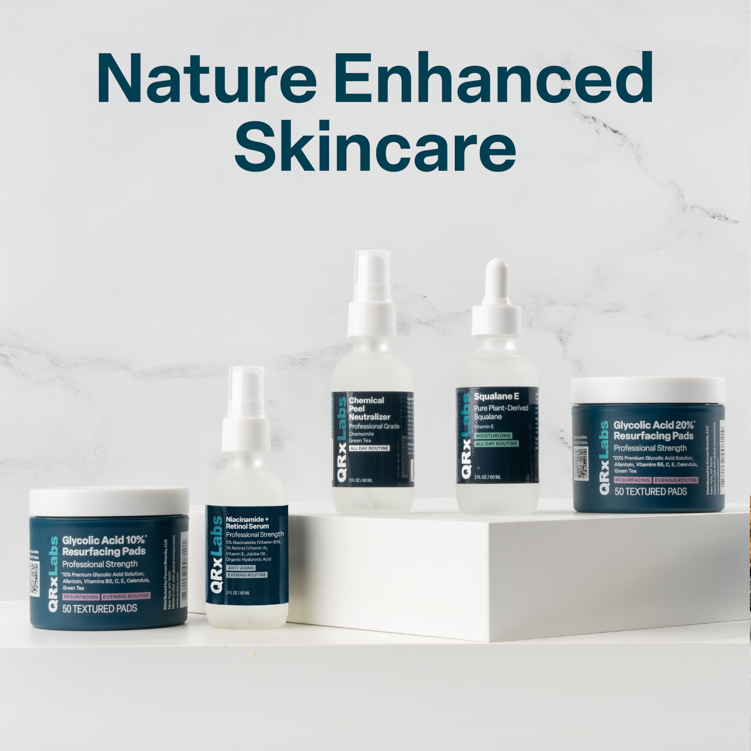 QRxLabs daily skincare routine shot with pads beside cleanser.