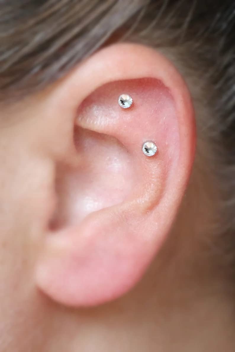 QWALIT piercing taper tip detail emphasizes secure grip during changes