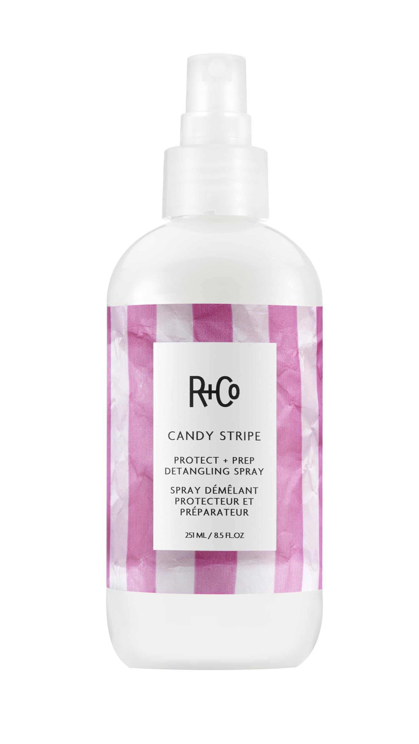 R+Co Candy Stripe Protect + Prep Detangling Spray bottle for quick detangling and protection.