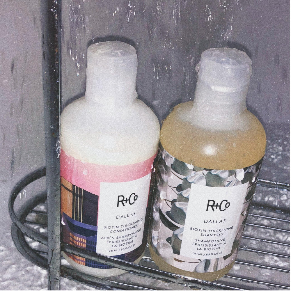 R+Co Dallas Biotin conditioner close-up features silky shine after use.