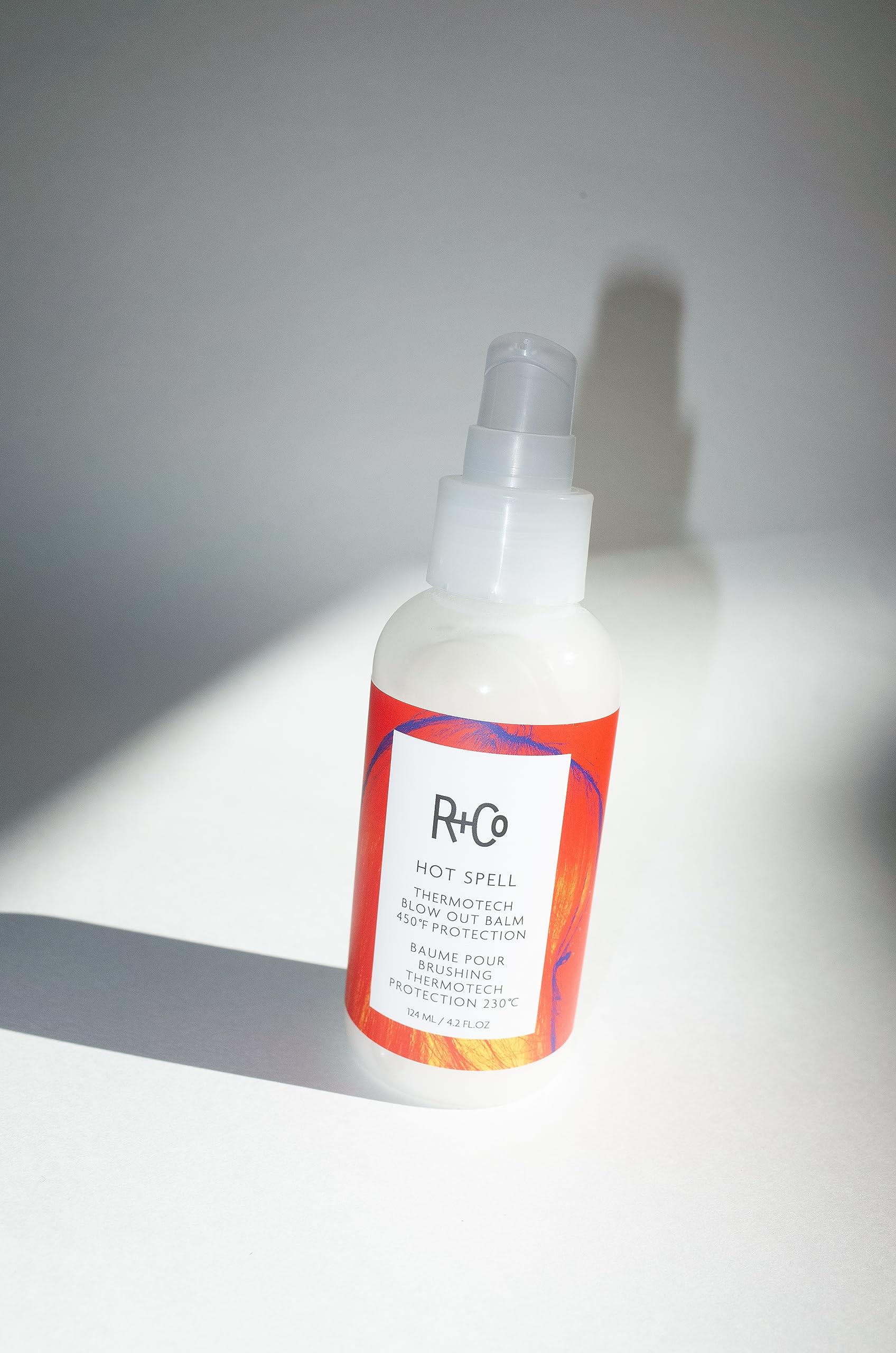 R+Co Thermotech Balm demonstrates 450°F heat protection during blow-drying
