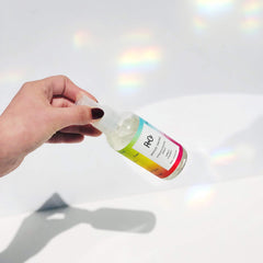 Close-up of Mood Swing liquid indicating smoother styling before heat tools.