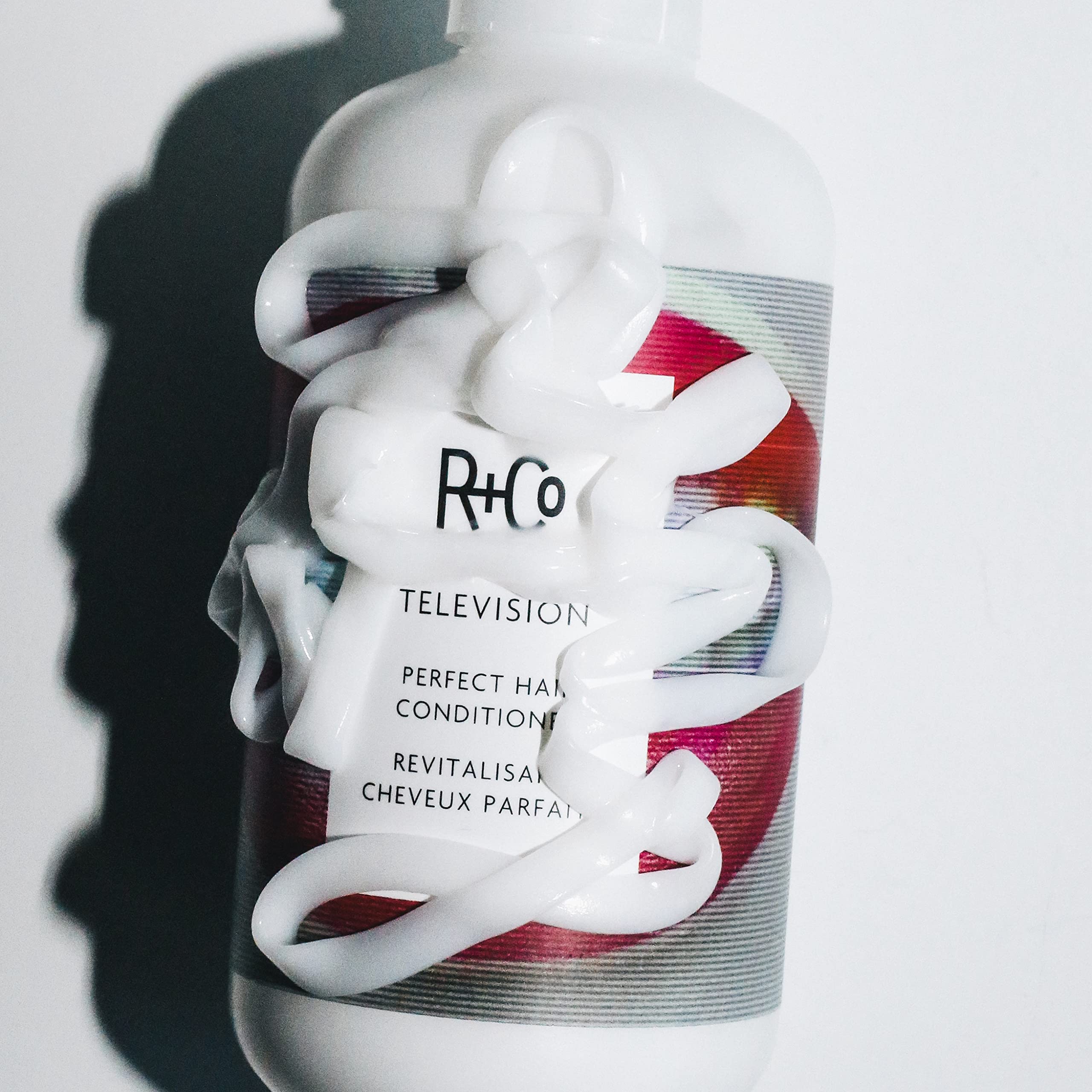 R+Co Television Perfect Hair Conditioner label showcases vegan and cruelty-free credentials.