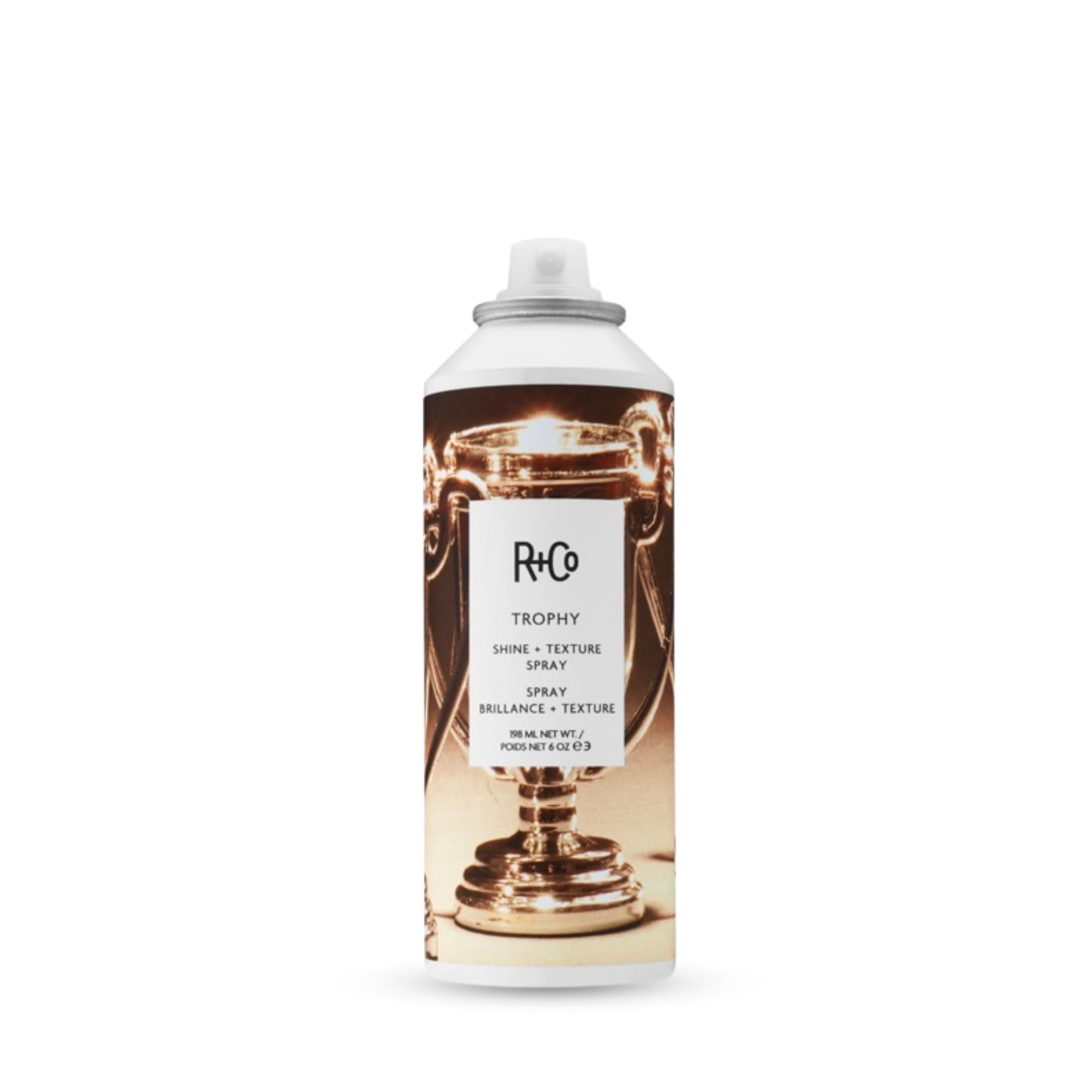 R+Co Trophy Shine + Texture Spray bottle pour adds texture for natural styling.