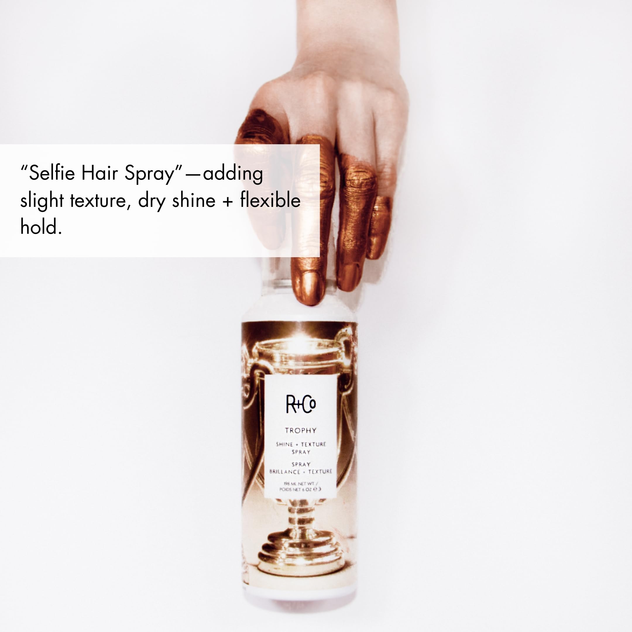 R+Co Trophy Shine + Texture Spray moisture infusion keeps hair hydrated and glossy.