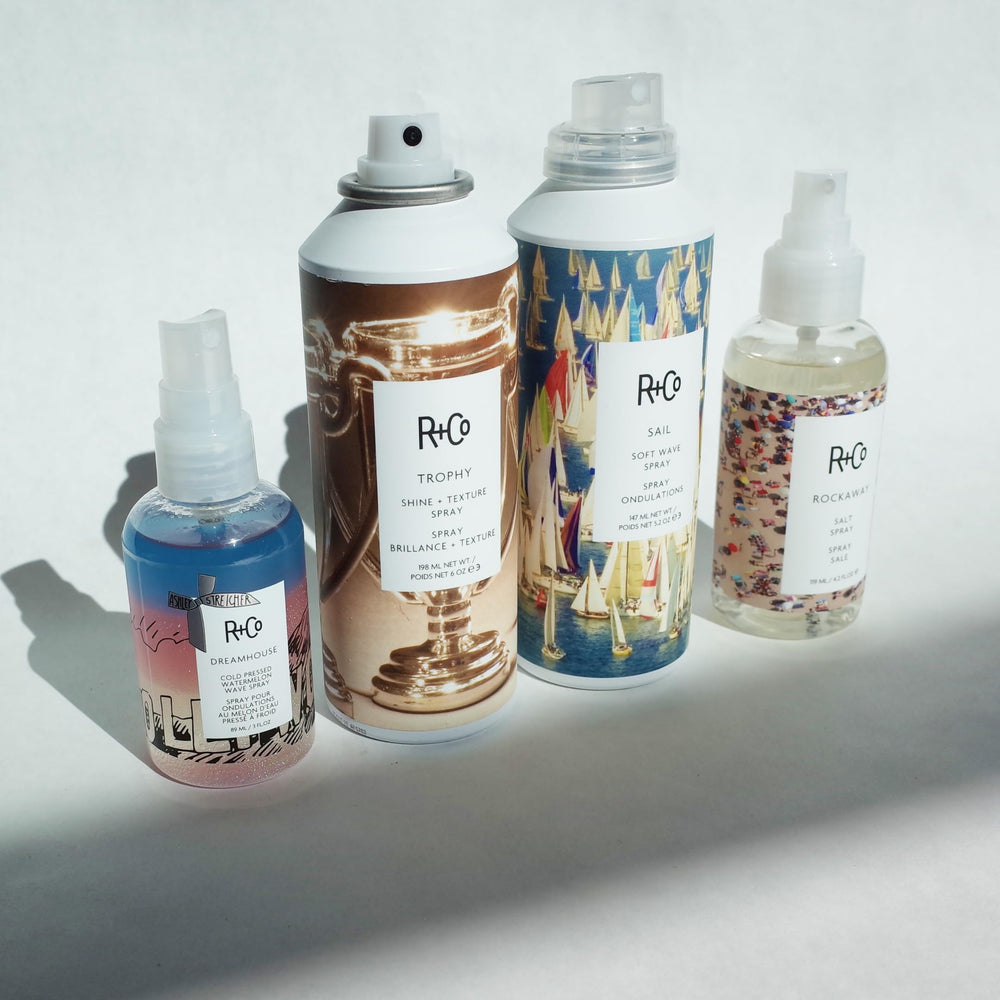 R+Co Trophy Shine + Texture Spray absorbs excess oil for a refreshed feel.
