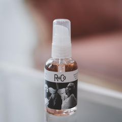 R+Co Two Way Mirror application close-up shows easy, weightless polish for hair.