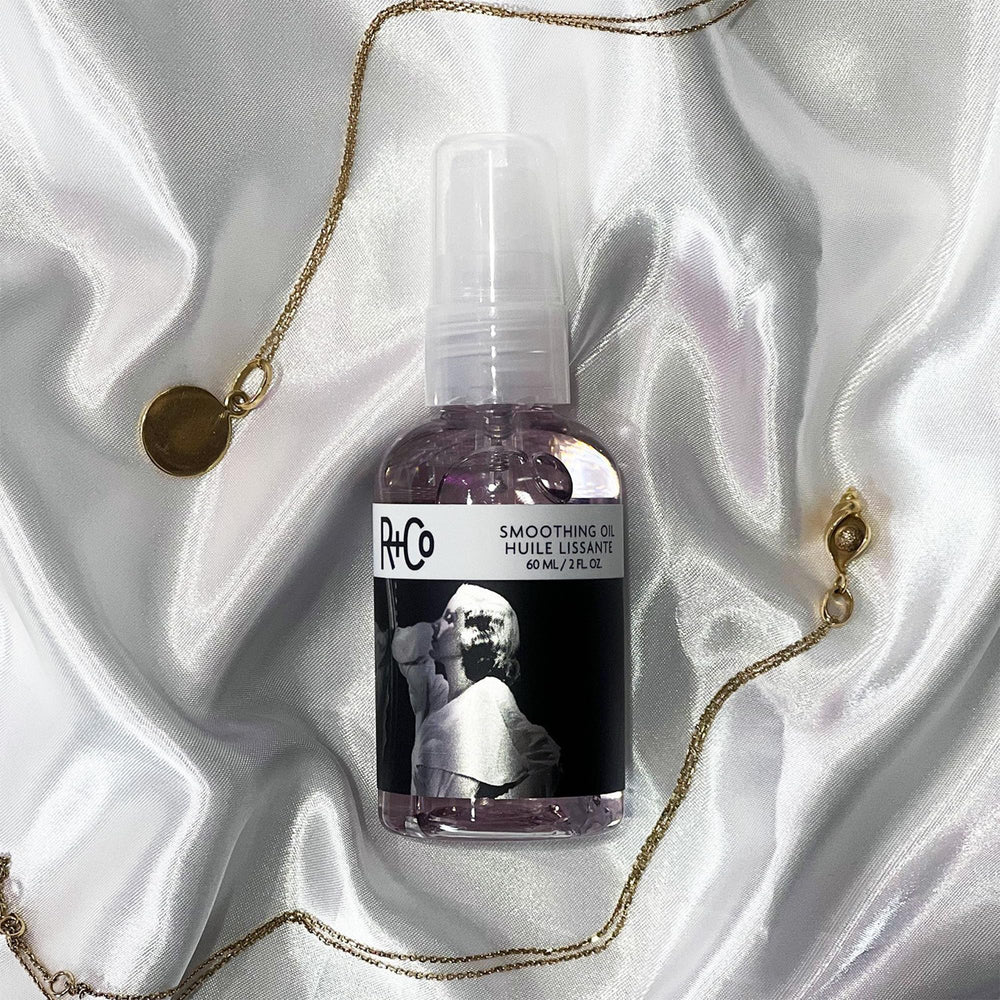 R+Co Two Way Mirror hair-gloss close-up emphasizes reflective shine and soft texture.