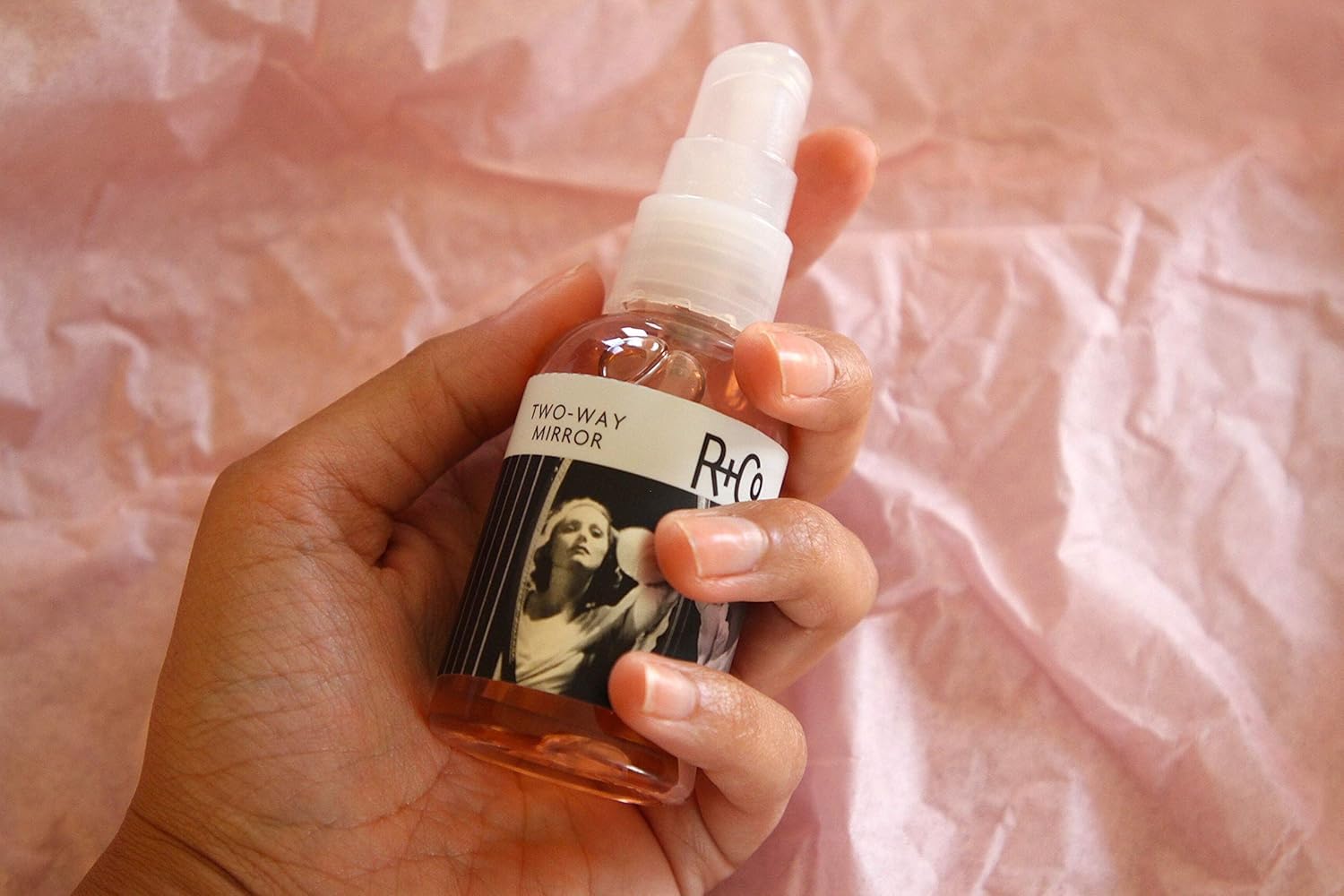 R+Co Two Way Mirror hydration boost image highlights deeply hydrated, silky hair.