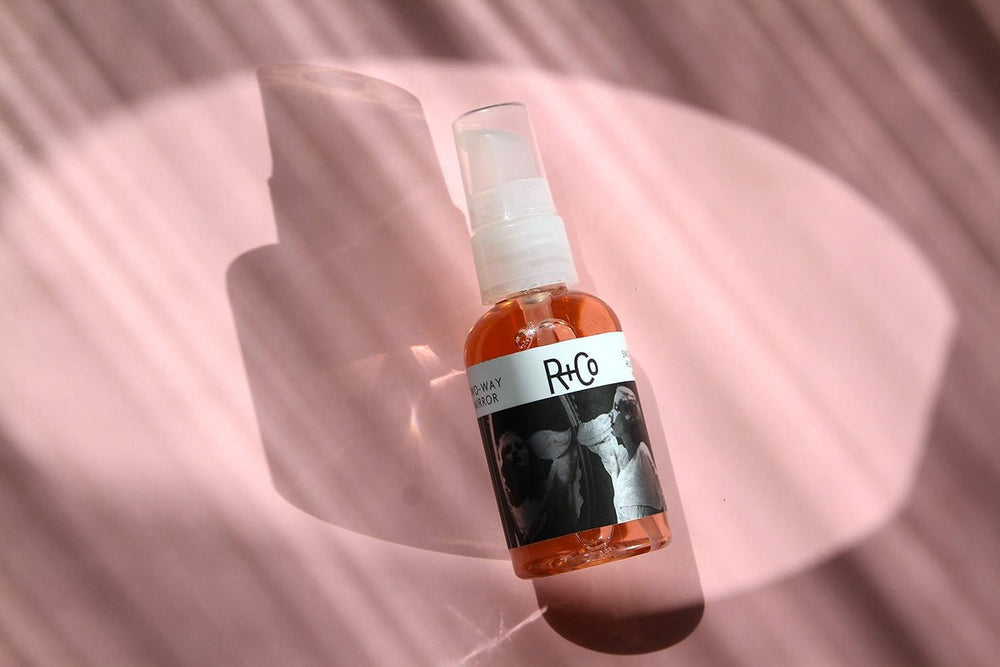 R+Co Two Way Mirror vitamin E care close-up underscores nourishing moisture.