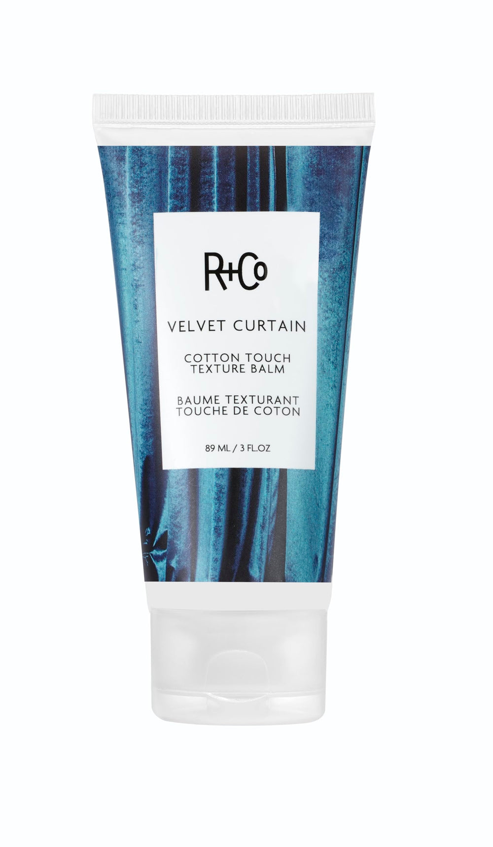 R+Co Velvet Curtain balm texture close-up for smooth, piecey hair.