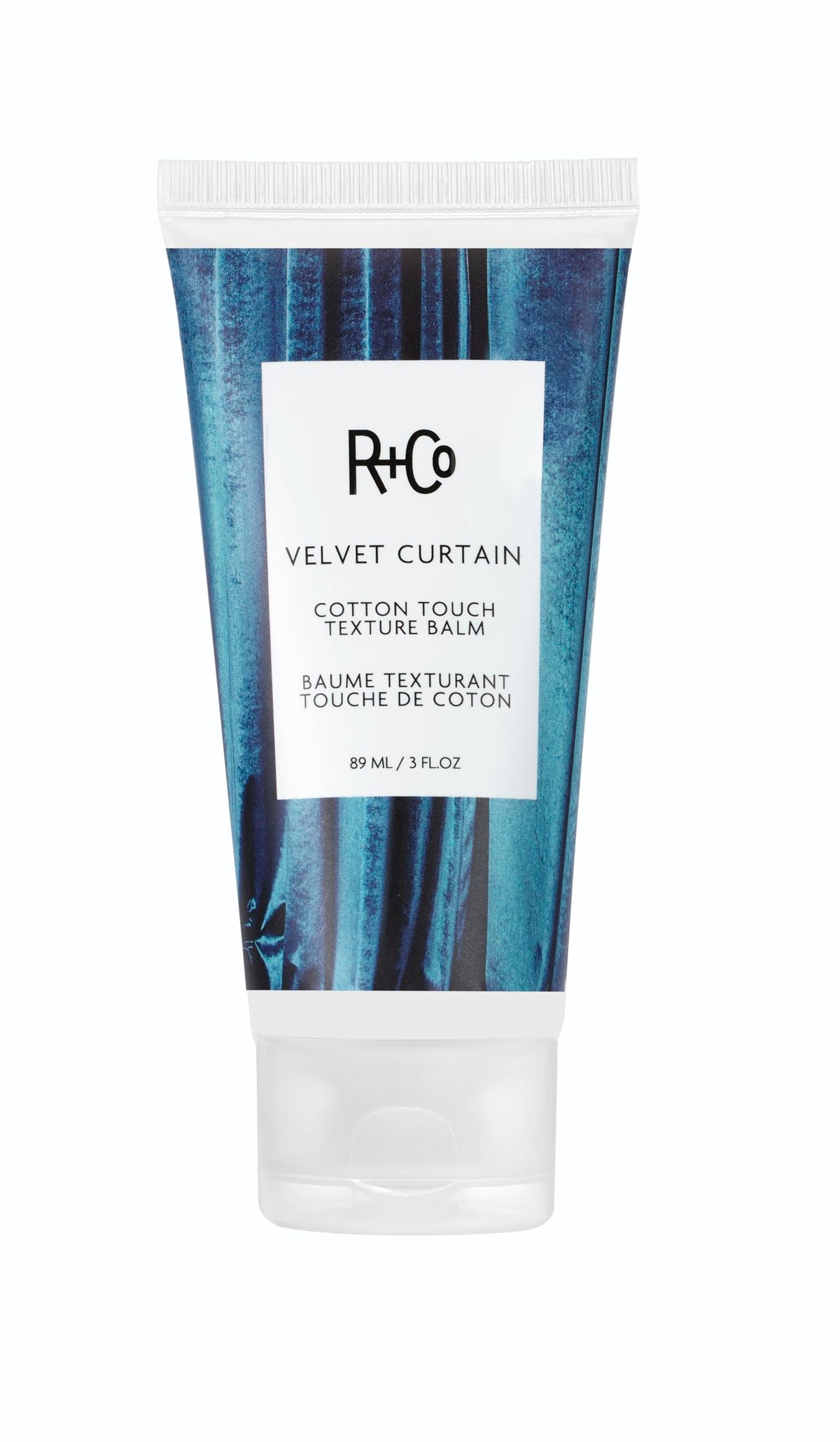 R+Co Velvet Curtain balm texture close-up for smooth, piecey hair.