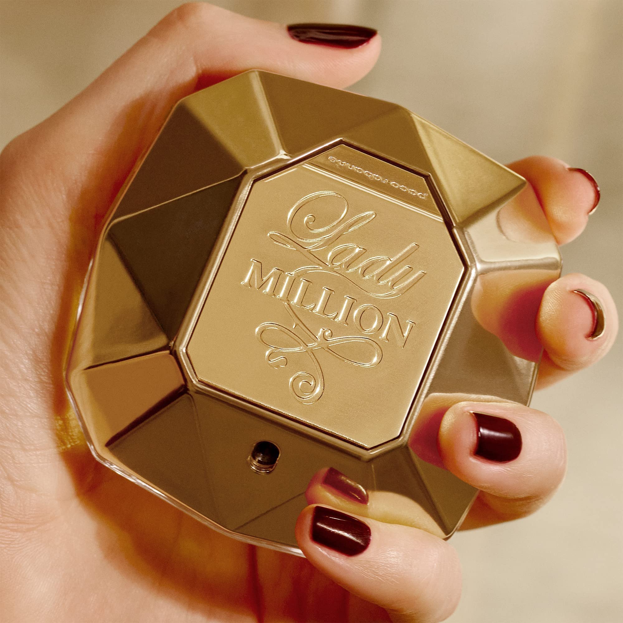 Rabanne Lady Million EDP perfume mist application demonstrates easy use