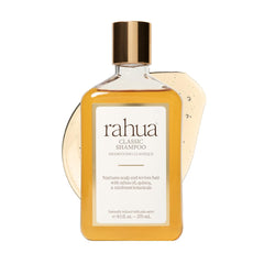 Rahua Classic Shampoo bottle with Palo Santo aroma promotes balanced scalp and hair vitality.