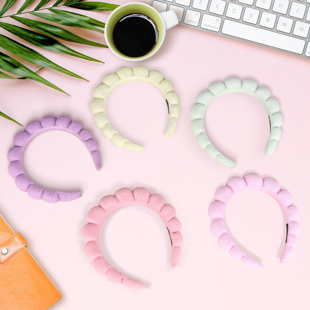 RAISEY headband absorbs water, keeps hair back during cleansing and makeup.