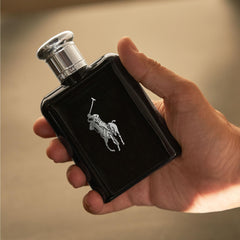 Polo Black spray pulse-points demonstrates application to pulse points.