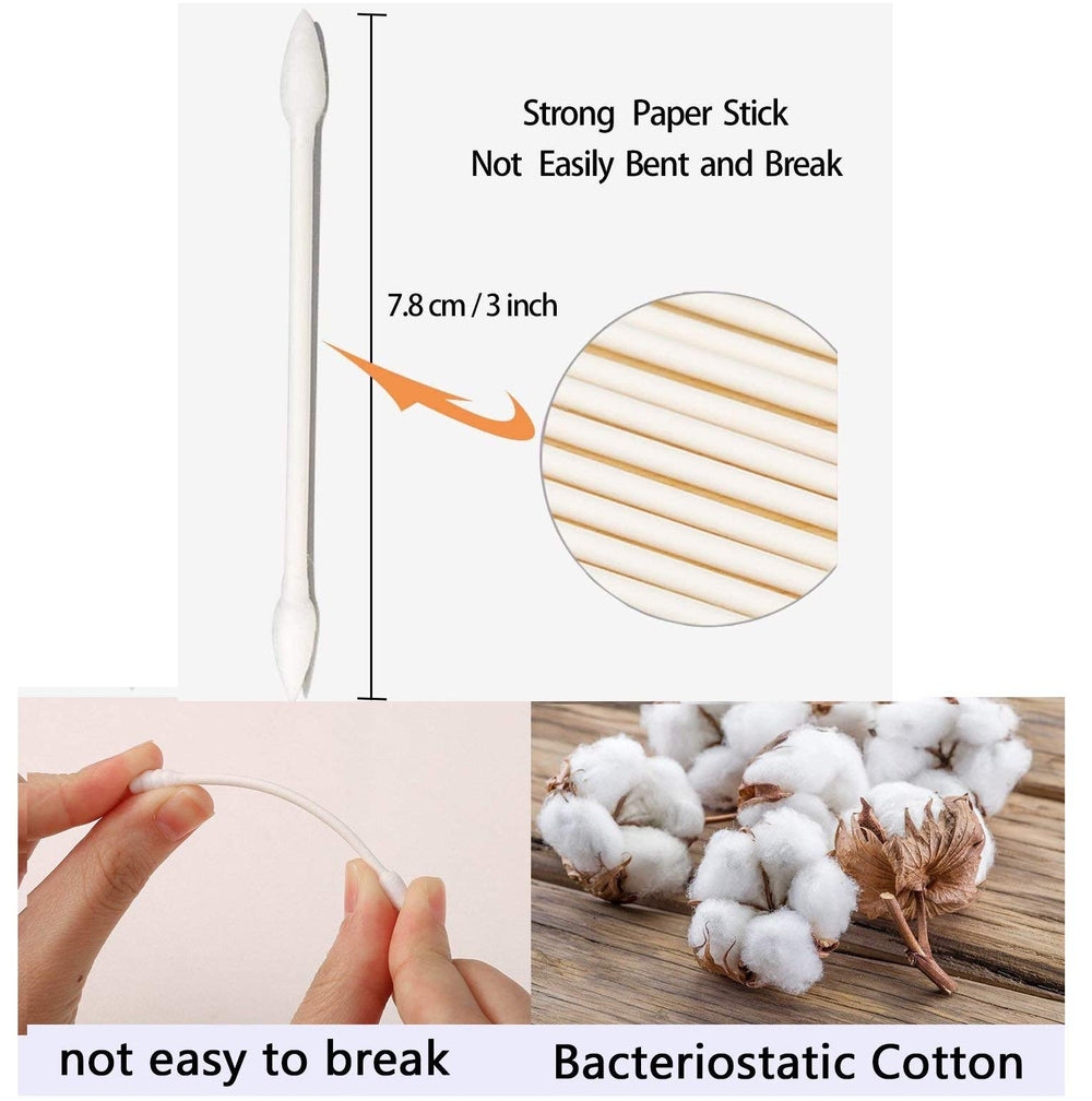 Rayhee swabs cleaning electronics, removing dust from keyboard and ports.