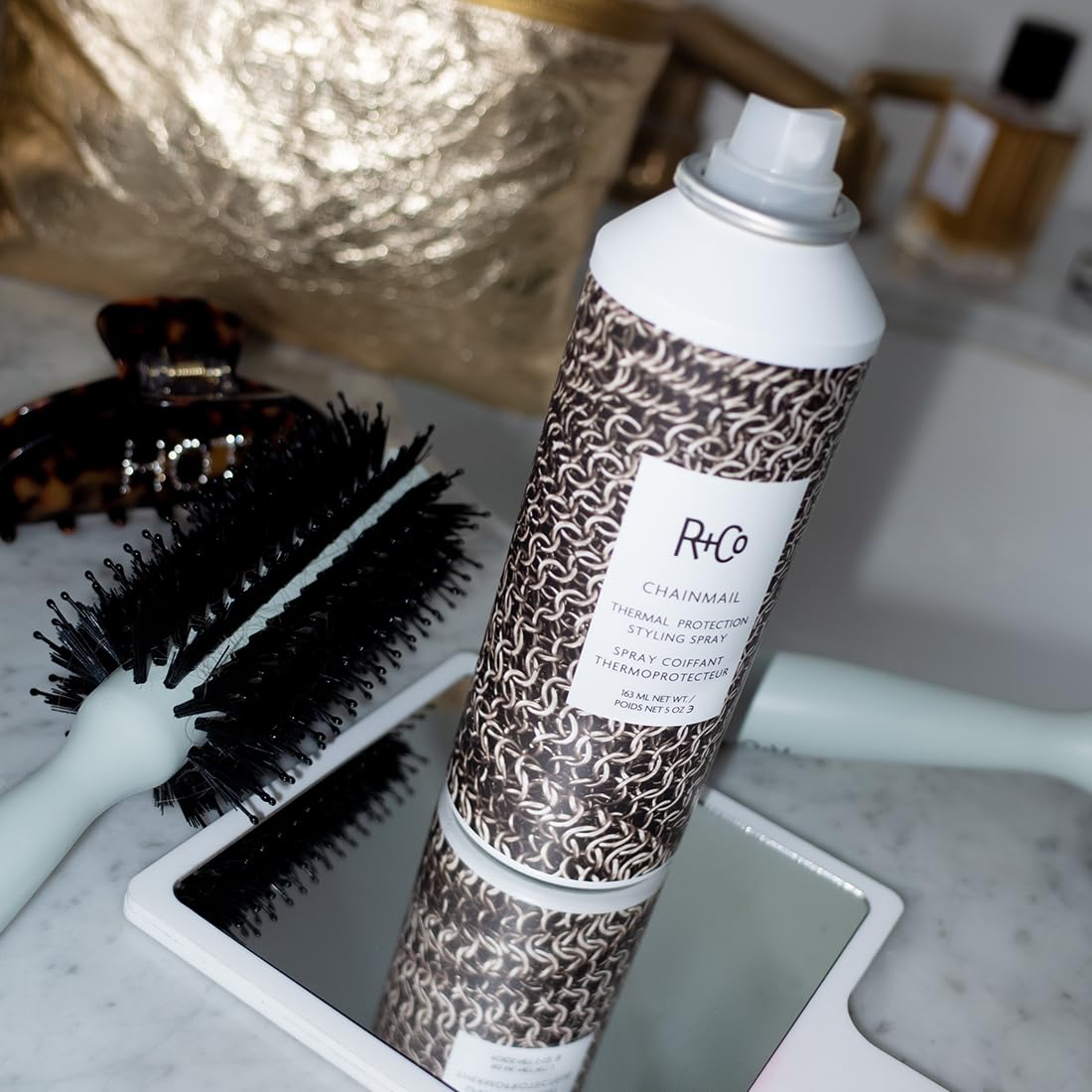 R+Co Chainmail hair spray on styled strands shows natural bounce